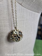 MaxSold Auction: Jewelry.  Floral black and white ball on Long Gold tone chain - Burnaby (British Columbia, Canada) SELLER MANAGED Downsizing Online Auction - Claude Avenue