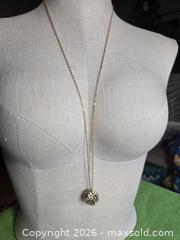 MaxSold Auction: Jewelry.  Floral black and white ball on Long Gold tone chain - Burnaby (British Columbia, Canada) SELLER MANAGED Downsizing Online Auction - Claude Avenue