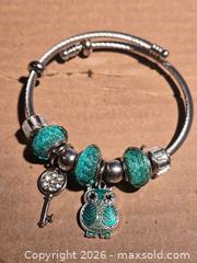 MaxSold Auction: Jewelry. Glittery Green Owl Charm Bracelet - Burnaby (British Columbia, Canada) SELLER MANAGED Downsizing Online Auction - Claude Avenue