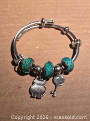 MaxSold Auction: Jewelry. Glittery Green Owl Charm Bracelet - Burnaby (British Columbia, Canada) SELLER MANAGED Downsizing Online Auction - Claude Avenue