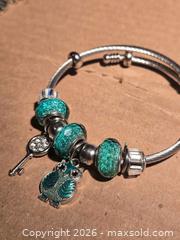 MaxSold Auction: Jewelry. Glittery Green Owl Charm Bracelet - Burnaby (British Columbia, Canada) SELLER MANAGED Downsizing Online Auction - Claude Avenue