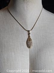 MaxSold Auction: Jewelry.   Gold tone chain with  Faux Gold/Diamond pendant - Burnaby (British Columbia, Canada) SELLER MANAGED Downsizing Online Auction - Claude Avenue