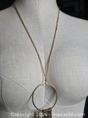 MaxSold Auction: Jewelry.   Industrial type necklace.  Large circle with hanging pieces - Burnaby (British Columbia, Canada) SELLER MANAGED Downsizing Online Auction - Claude Avenue
