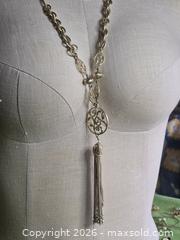 MaxSold Auction: Jewelry. Long silver tone multi link chain with long tassel - Burnaby (British Columbia, Canada) SELLER MANAGED Downsizing Online Auction - Claude Avenue