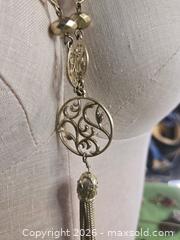 MaxSold Auction: Jewelry. Long silver tone multi link chain with long tassel - Burnaby (British Columbia, Canada) SELLER MANAGED Downsizing Online Auction - Claude Avenue