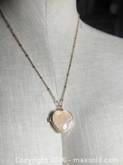MaxSold Auction: Jewelry. Pink Stone Heart Locket on Gold tone chain - Burnaby (British Columbia, Canada) SELLER MANAGED Downsizing Online Auction - Claude Avenue