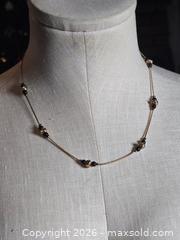 MaxSold Auction: Jewelry.  Thin gold tone chain with black / gold embellishments - Burnaby (British Columbia, Canada) SELLER MANAGED Downsizing Online Auction - Claude Avenue