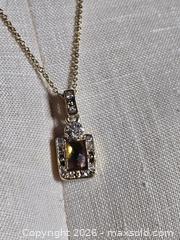 MaxSold Auction: Jewelry.  Vintage looking Amber charm with faux diamond pendant on gold tone chain - Burnaby (British Columbia, Canada) SELLER MANAGED Downsizing Online Auction - Claude Avenue