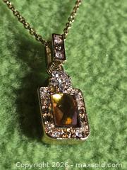 MaxSold Auction: Jewelry.  Vintage looking Amber charm with faux diamond pendant on gold tone chain - Burnaby (British Columbia, Canada) SELLER MANAGED Downsizing Online Auction - Claude Avenue