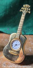 MaxSold Auction: Small Clocks.  Guitar and Motorcycle - Burnaby (British Columbia, Canada) SELLER MANAGED Downsizing Online Auction - Claude Avenue