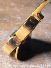 MaxSold Auction: Small Clocks.  Guitar and Motorcycle - Burnaby (British Columbia, Canada) SELLER MANAGED Downsizing Online Auction - Claude Avenue