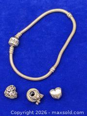 MaxSold Auction: Sterling Silver 925 Pandora Bracelet & 3 Pandora Charms (ALE 925) - Cobourg (Ontario, Canada) SELLER MANAGED Moving Online Auction - Burnham Street