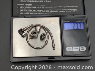 MaxSold Auction: Sterling Silver 925 Pandora Bracelet & 3 Pandora Charms (ALE 925) - Cobourg (Ontario, Canada) SELLER MANAGED Moving Online Auction - Burnham Street