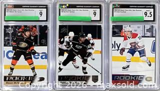 MaxSold Auction: 2021-22 Upper Deck NHL Star Rookies Graded Lot of 3 — McTavish, Byfield, Caufield - Cobourg (Ontario, Canada) SELLER MANAGED Reseller Online Auction - Elgin Street West