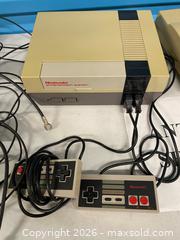 MaxSold Auction: Nintendo NES & Super Nintendo SNES Console Bundle with Controllers & Cables - Vancouver (British Columbia, Canada) SELLER MANAGED Reseller Online Auction - East 7th Avenue (STORAGE)