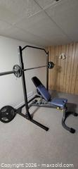 MaxSold Auction: Weight lifting rack, bench, Olympic bar, plates  - Ottawa (Ontario, Canada) SELLER MANAGED Downsizing Online Auction - Mowat Street