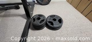 MaxSold Auction: Weight lifting rack, bench, Olympic bar, plates  - Ottawa (Ontario, Canada) SELLER MANAGED Downsizing Online Auction - Mowat Street