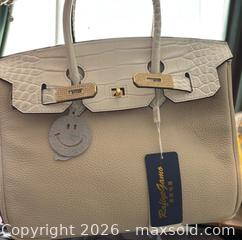 MaxSold Auction: Cowhide leather satchel with crossbody strap - Ottawa (Ontario, Canada) SELLER MANAGED Downsizing Online Auction - Darvoy Mews