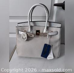 MaxSold Auction: Cowhide leather satchel with crossbody strap - Ottawa (Ontario, Canada) SELLER MANAGED Downsizing Online Auction - Darvoy Mews