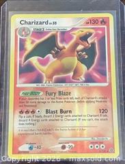 MaxSold Auction: Pokémon Charizard 3/143 D&P Secret Wonders Holo Collectible Trading Card  - Newmarket (Ontario, Canada) PARTNER MANAGED Reseller Online Auction - Walter Avenue