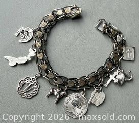 MaxSold Auction: Sterling Silver Charm Bracelet with (8) Sterling Silver Charms - Toronto (Ontario, Canada) PARTNER MANAGED Reseller Online Auction - Queen Street West