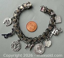 MaxSold Auction: Sterling Silver Charm Bracelet with (8) Sterling Silver Charms - Toronto (Ontario, Canada) PARTNER MANAGED Reseller Online Auction - Queen Street West