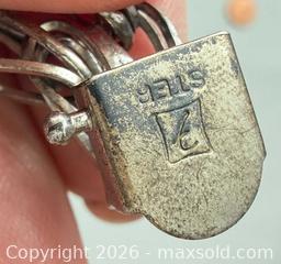 MaxSold Auction: Sterling Silver Charm Bracelet with (8) Sterling Silver Charms - Toronto (Ontario, Canada) PARTNER MANAGED Reseller Online Auction - Queen Street West