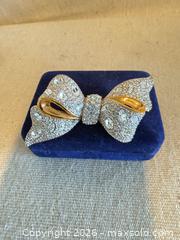 MaxSold Auction: Swarovski Gold-Plated Bow Brooch Pin, About 3 in (7.5 cm)marked  - Toronto (Ontario, Canada) SELLER MANAGED Downsizing Online Auction - Weston Road (CONDO)