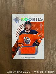 MaxSold Auction: 2018/19 Upper Deck Ultimate Rookies Evan Bouchard Rookie Patch #56/399 - Oshawa (Ontario, Canada) SELLER MANAGED Reseller Online Auction - Margaret Street