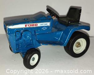 MaxSold Auction: Vintage blue Ford hydrostatic LGT145 die-cast toy tractor  - Walworth (New York, USA) SELLER MANAGED Downsizing Online Auction - High Street