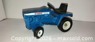 MaxSold Auction: Vintage blue Ford hydrostatic LGT145 die-cast toy tractor  - Walworth (New York, USA) SELLER MANAGED Downsizing Online Auction - High Street