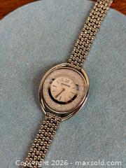 MaxSold Auction: Swarovski 'Crystalline Oval' Silver Tone Watch - Hamilton (Ontario, Canada) SELLER MANAGED Estate Sale Online Auction - Gertrude Street