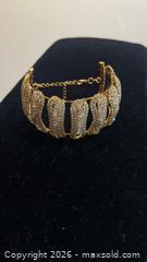 MaxSold Auction: Stunning Gold Finish Swarovski Crystal like Bangld  - Toronto (Ontario, Canada) SELLER MANAGED Estate Sale Online Auction -  Saunders Road