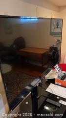 MaxSold Auction: 55" Haier TV and Black Tempered Glass TV Stand  - Kingston (Ontario, Canada) PARTNER MANAGED Downsizing Online Auction - Buckingham Court