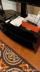 MaxSold Auction: 55" Haier TV and Black Tempered Glass TV Stand  - Kingston (Ontario, Canada) PARTNER MANAGED Downsizing Online Auction - Buckingham Court