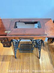 MaxSold Auction: ANTIQUE SINGER OAK AND IRON SEWING MACHINE TABLE - Toronto (Ontario, Canada) PARTNER MANAGED Moving Online Auction - Brunswick Avenue