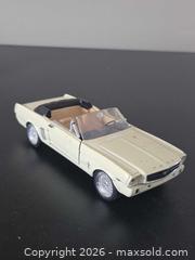 MaxSold Auction: White Ford Mustang convertible metal diecast car - Ottawa (Ontario, Canada) SELLER MANAGED Downsizing Online Auction - Seabrooke Drive