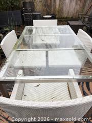MaxSold Auction: Outdoor dining set - glass top table with 4 white chairs and outdoor carpet - Delta (British Columbia, Canada) SELLER MANAGED Estate Sale Online Auction -  55b Street