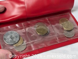 MaxSold Auction: Coin Collection In red plastic sleeve holder  - South Frontenac (Ontario, Canada) SELLER MANAGED Downsizing Online Auction - Battersea Road