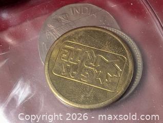 MaxSold Auction: Coin Collection In red plastic sleeve holder  - South Frontenac (Ontario, Canada) SELLER MANAGED Downsizing Online Auction - Battersea Road