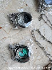 MaxSold Auction: Mixed Lot of 6 Stainless Steel lockets and chains - London (Ontario, Canada) SELLER MANAGED Downsizing Online Auction - Marconi Boulevard