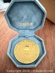 MaxSold Auction: Birks commemorative medal from the University of Toronto Schools - Toronto (Ontario, Canada) SELLER MANAGED Downsizing Online Auction - Applefield Drive