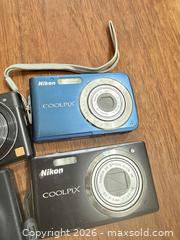 MaxSold Auction: Nikon camera lot  - Toronto (Ontario, Canada) SELLER MANAGED Downsizing Online Auction - Applefield Drive