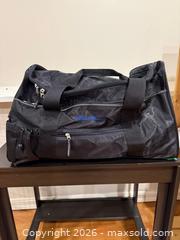MaxSold Auction: Eddie Bauer duffle bag and Samsonite carry-on - Ottawa (Ontario, Canada) SELLER MANAGED Downsizing Online Auction - Brennan Avenue