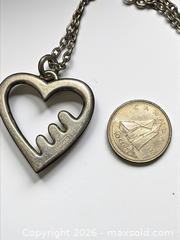 MaxSold Auction: Sterling Silver Coach Heart Necklace 36" Length 19.06g - Esquimalt (British Columbia, Canada) PARTNER MANAGED Estate Sale Online Auction - Lampson Street