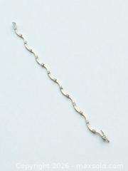 MaxSold Auction: Sterling Silver Curved Link Bracelet with Clear Gemstones 7" Length 6.45g - Esquimalt (British Columbia, Canada) PARTNER MANAGED Estate Sale Online Auction - Lampson Street
