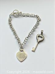 MaxSold Auction: Sterling Silver Heart 7.5" Bracelet and Key Pendant 9.92g total - Esquimalt (British Columbia, Canada) PARTNER MANAGED Estate Sale Online Auction - Lampson Street