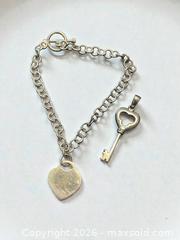 MaxSold Auction: Sterling Silver Heart 7.5" Bracelet and Key Pendant 9.92g total - Esquimalt (British Columbia, Canada) PARTNER MANAGED Estate Sale Online Auction - Lampson Street
