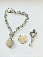 MaxSold Auction: Sterling Silver Heart 7.5" Bracelet and Key Pendant 9.92g total - Esquimalt (British Columbia, Canada) PARTNER MANAGED Estate Sale Online Auction - Lampson Street
