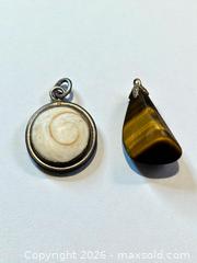 MaxSold Auction: Sterling Silver Shell Pendant and Tigers Eye Pendant 9.45g - Esquimalt (British Columbia, Canada) PARTNER MANAGED Estate Sale Online Auction - Lampson Street